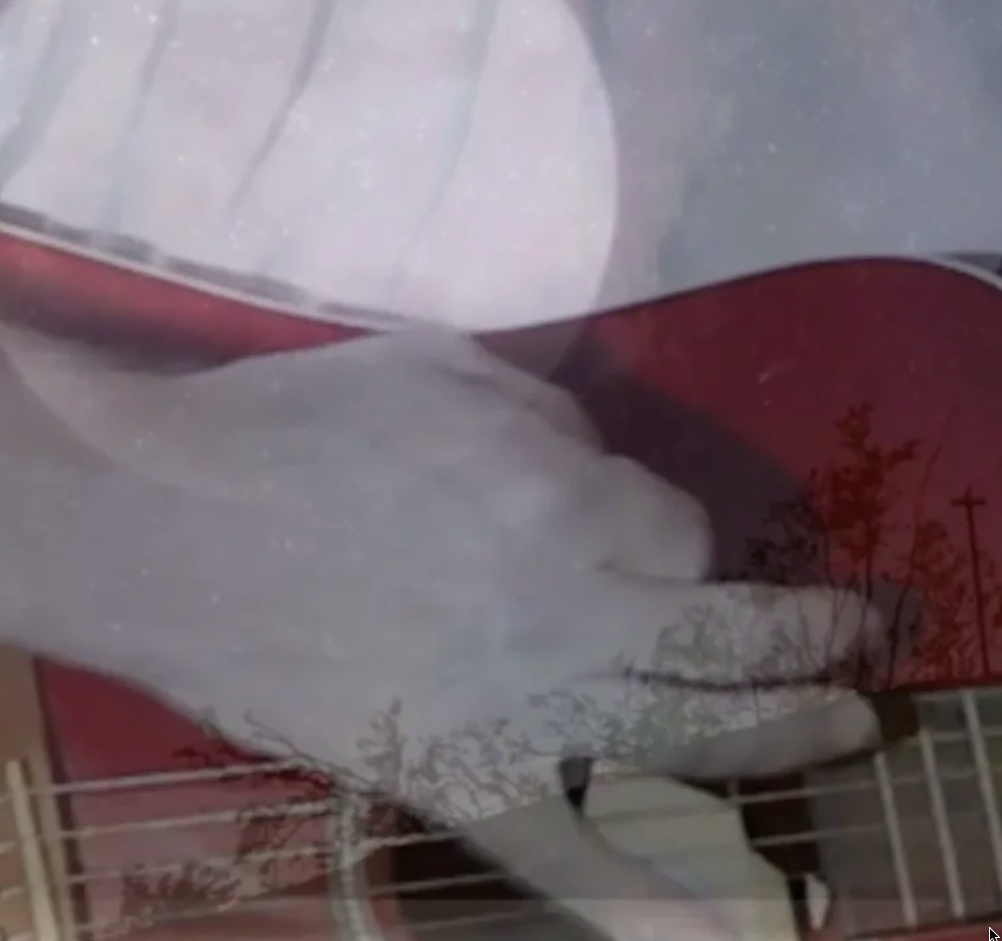 Hand over guitar